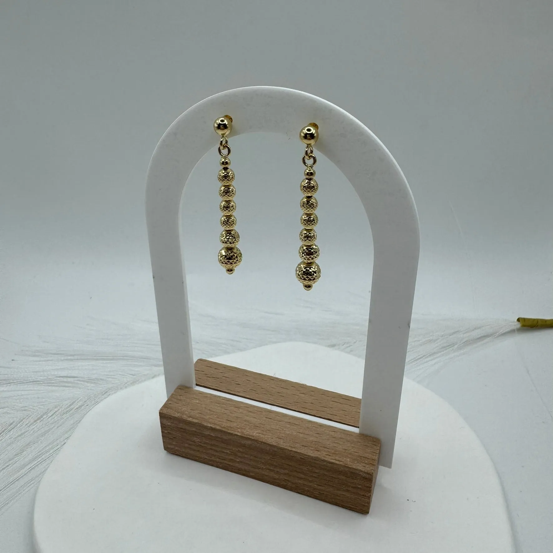 Orecchini pendente sfere martellate oro